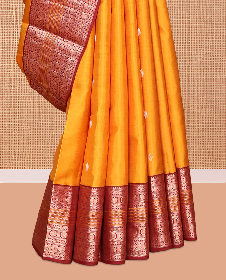 Yellow Vasundhara Silk Saree, Finely Crafted with Zari Buttas, Contrast Border of Thilakam Mokku, Muthu, Mayil, Chakram, Neli, and Kuthirai Designs, Jaal Pallu, and a Contrast Blouse