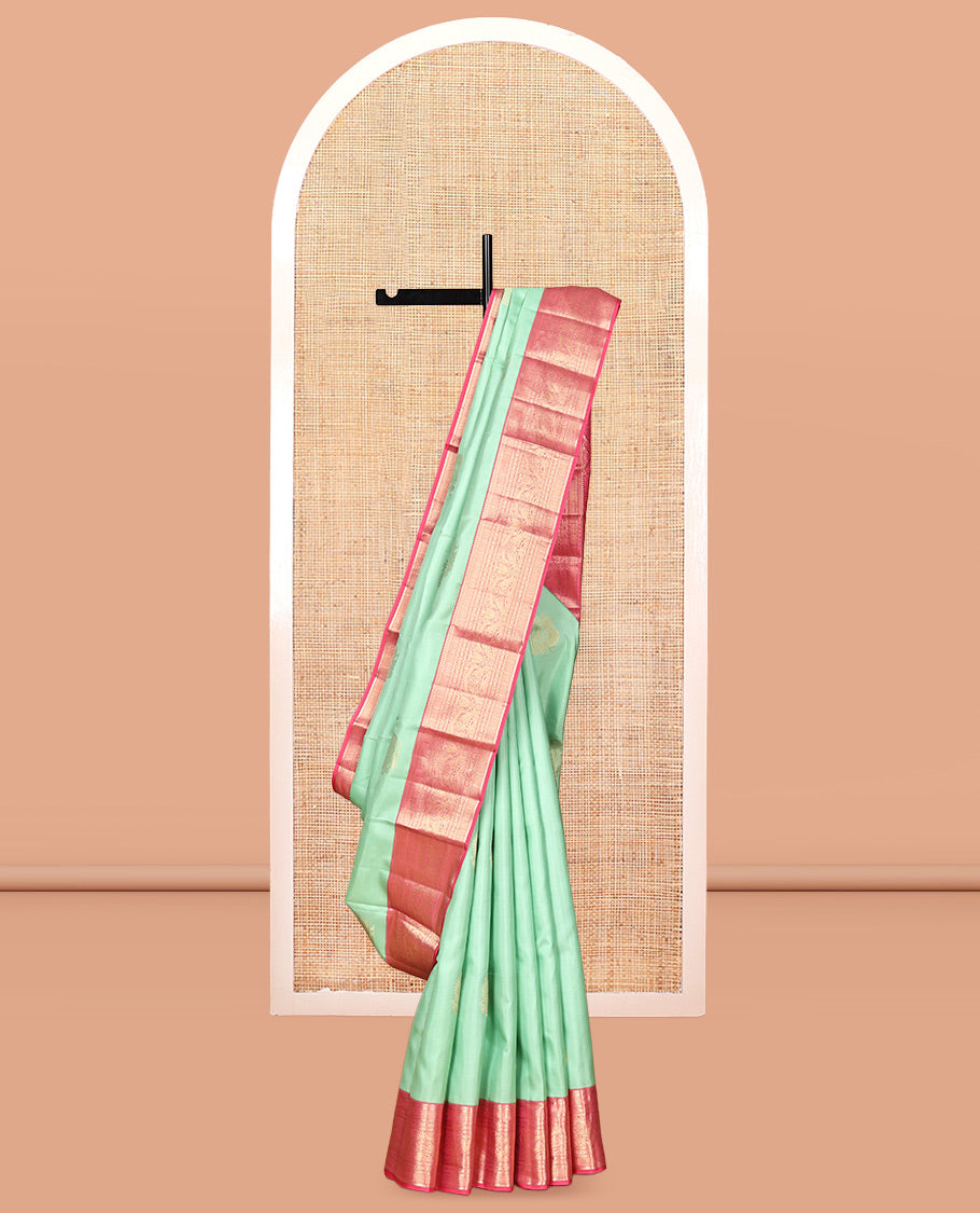 Green Vasundhara Silk Saree, Delicately Woven with Zari Buttas, Contrast Border of Thilakam, Kathir, Mayil Kann, Cross Kamalam, and Yaali Designs, Grand Pallu, and Contrast Blouse