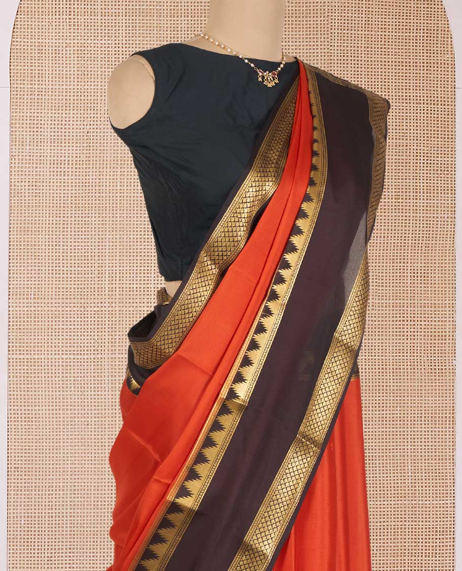 Rust Orange Plain Mysore Silk Saree, Gracefully Embellished with a Contrast Temple Border of Jaal Designs, Pallu Steeped with Zari Stripes, and Paired with a Contrast Blouse