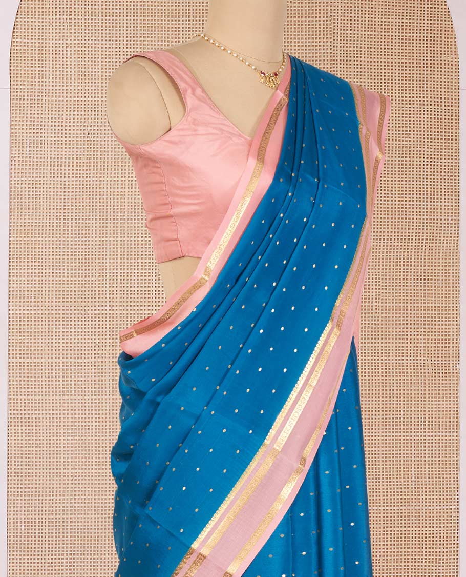 Blue Mysore Silk Saree Delicately Woven with Zari Buttas, Complemented by a Contrast Border Featuring Traditional Zari Designs, Pallu Steeped with Zari Stripes, and Paired with a Contrast Blouse