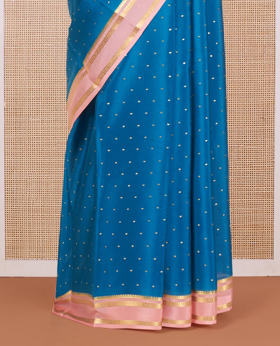 Blue Mysore Silk Saree Delicately Woven with Zari Buttas, Complemented by a Contrast Border Featuring Traditional Zari Designs, Pallu Steeped with Zari Stripes, and Paired with a Contrast Blouse