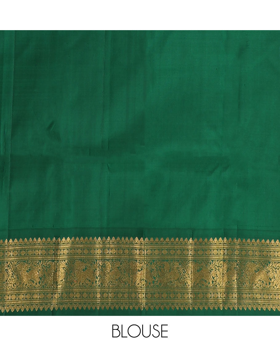 Green kamalam buttas Kanchipuram silk sareee, contrast korvai border of thilakam mokku, kathir, rudraksham, mayil, yaali and jaal design, and zari motifs pallu