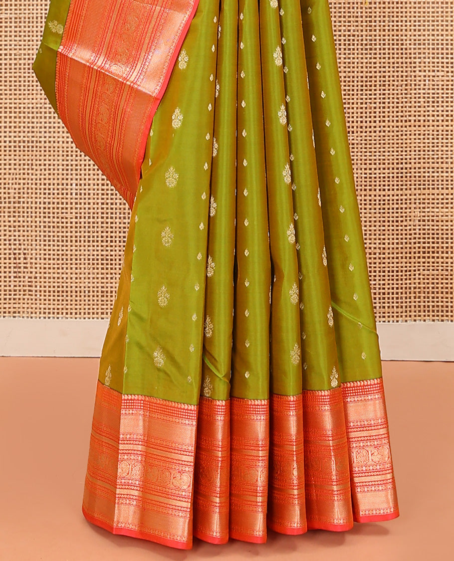 Green Vasundhara Lite Silk Mix Saree Accentuated with Zari Buttas, Complemented with a Contrast Border Featuring Manga, Muthu, Kamalam, Neli, Vanki, and Mayil Designs, a Grandly Zari-Decked-Up Pallu, and a Contrast Blouse