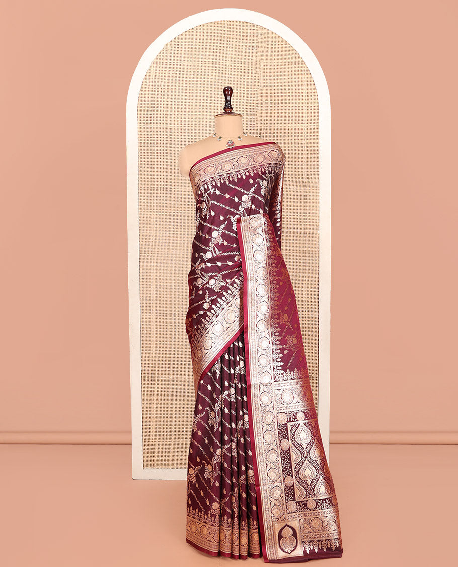 Wine Banarasi Nylon Saree, Prettified with Zari Designs, Highlighted by a Floral Creeper Zari Border, Intricate Pallu, and a Matching Blouse