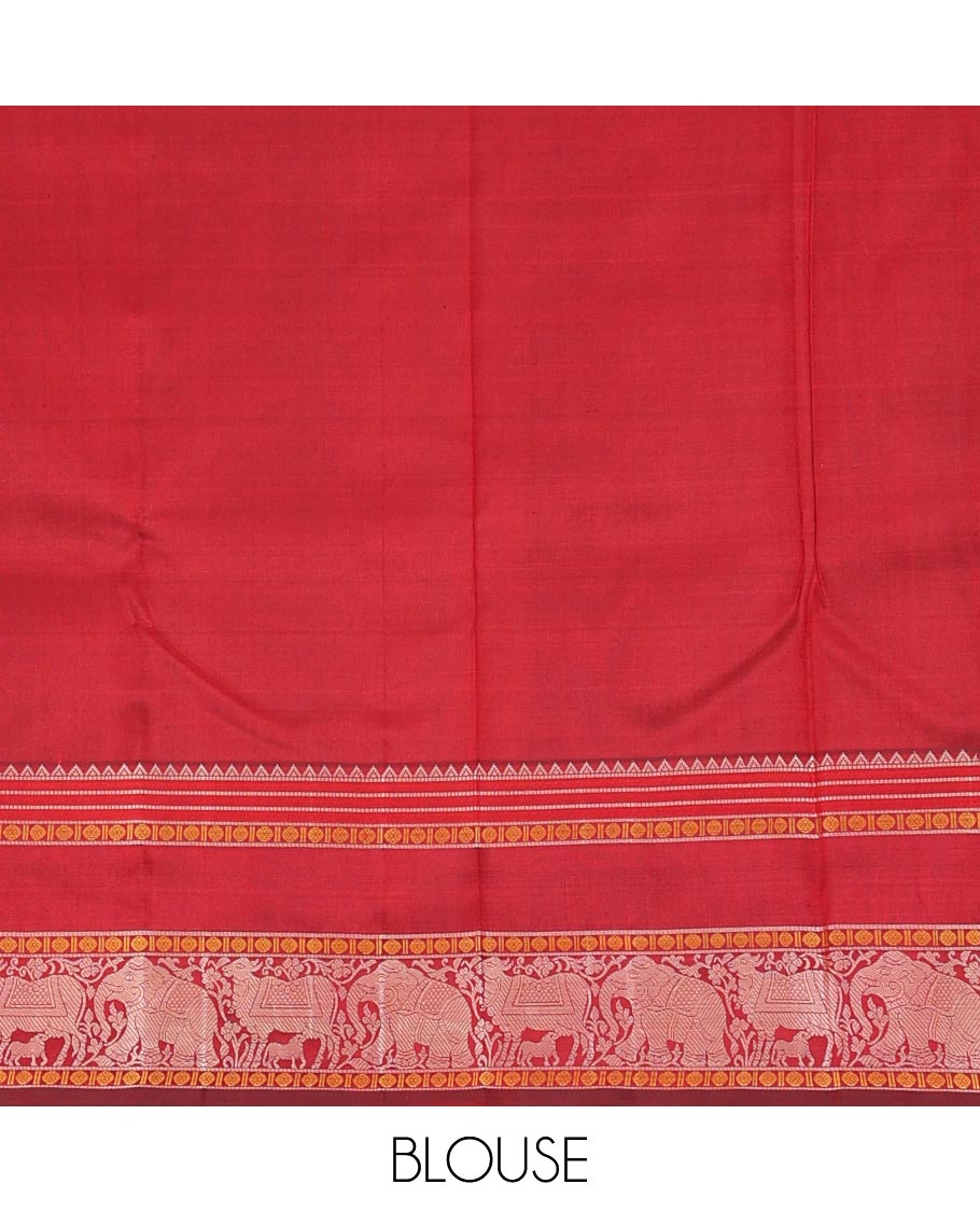 Red thread buttas Kanchipuram silk saree, rettai pettu border of rekku, rudraksham, yaanai, and Pichwai cow designs, and pallu features Vrishabha Kunjara design