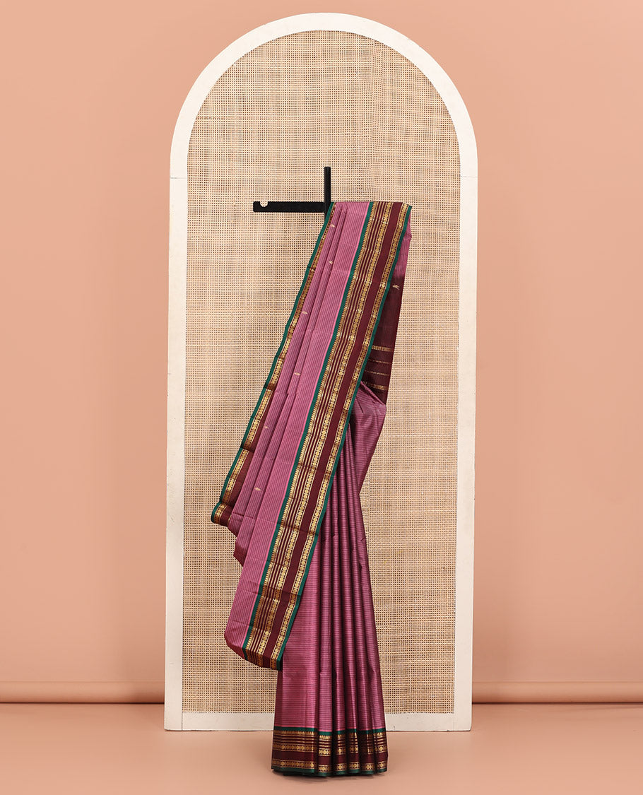 Rosewood Pink Kanchipuram Silk Saree Adorned with Vazhaipoo Stripes and Zari Buttas, Complemented by a Contrast Rettai Pettu Border Featuring Thazampoo Rekku, Muthu, Neli, and Rudraksham Designs, Gleaming Zari Pallu, and Paired with a Contrast Blouse