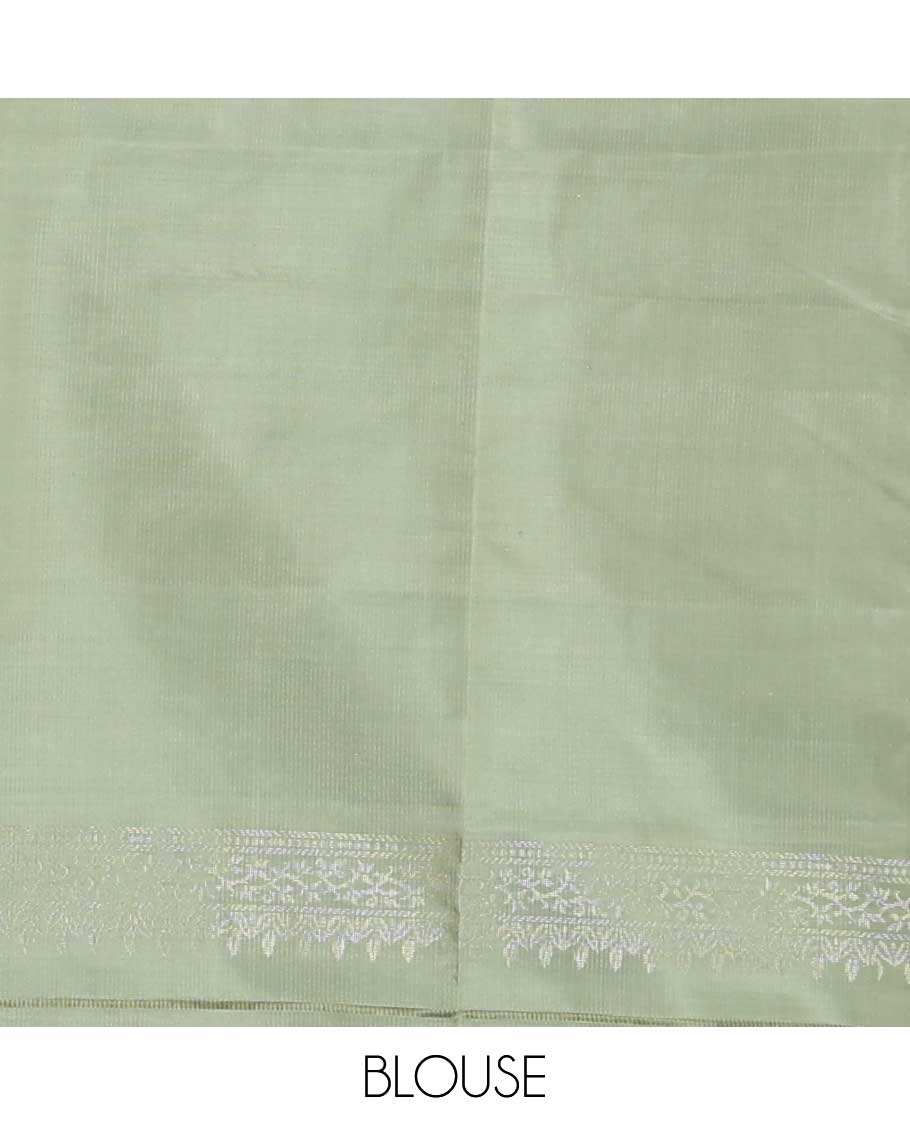 Pastel green floral motifs soft silk saree, floral jaal design border, and pallu of sparesly woven floral jaal design