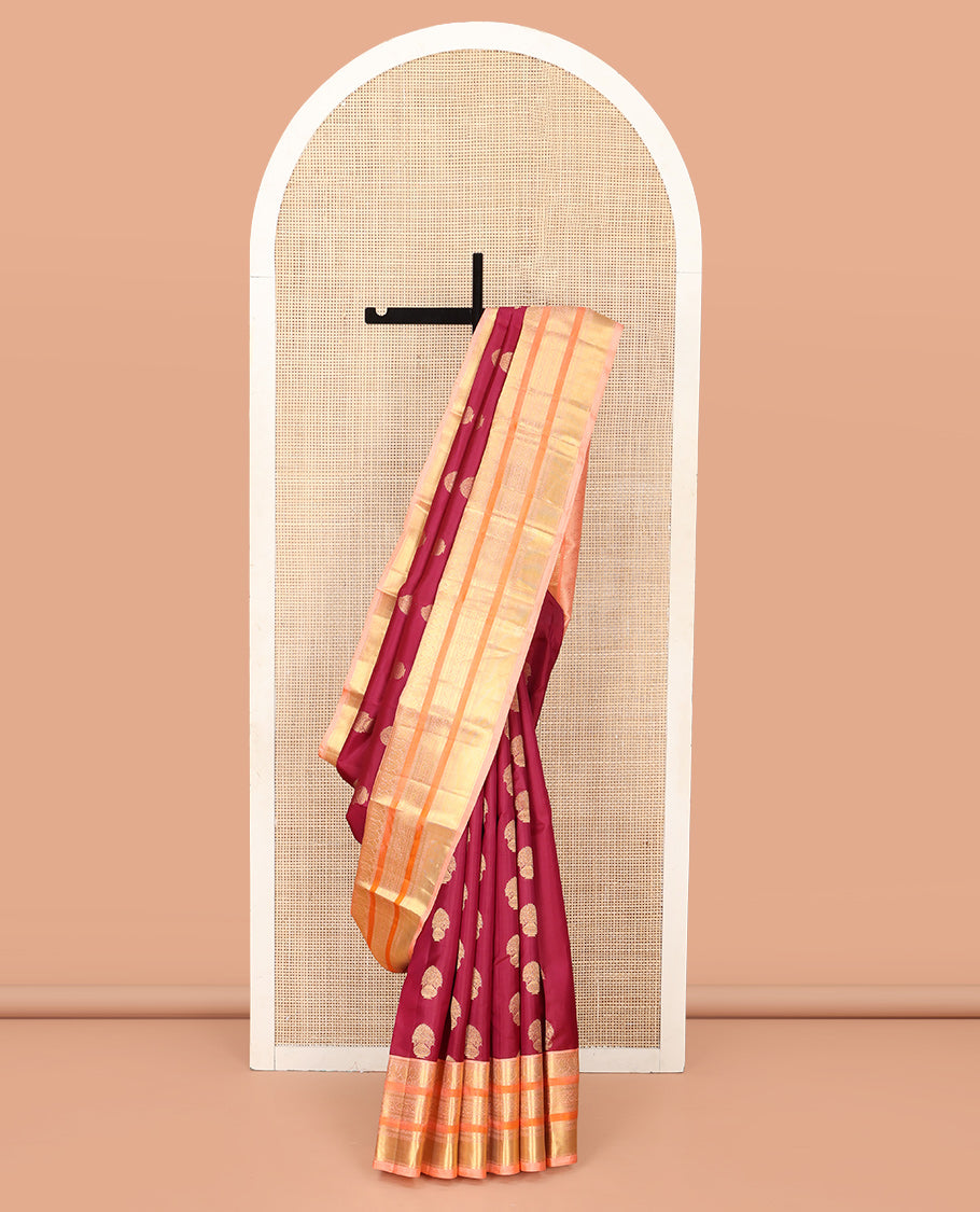 Maroon Vasundhara Silk Saree, Detailed with Floral Zari Buttas All Over Its Body, Complemented by a Contrast Border of Salngai, Mayil, Rettai Neli, and Kodi Visiry Designs, Pallu Steeped with Kodi Visiry Designs, and Paired with a Contrast Blouse