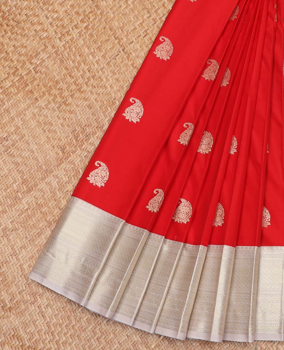 Red Budget Silk Saree Enthralled with Paisley Zari Buttas, Complemented by a Contrast Border Steeped with Traditional Zari Designs, Subtly Designed Jaal Pallu, and Paired with a Contrast Blouse
