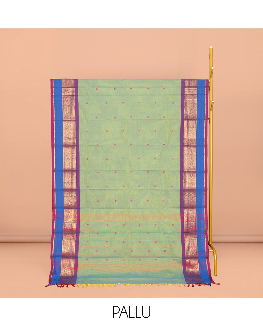 Green Chettinad Cotton Saree, Ornamented with Buttas All Over Its Body, Complemented by a Contrast Traditional Zari Rettai Pettu Border, Pallu of Stripes and Buttas, and Paired with a Matching Blouse