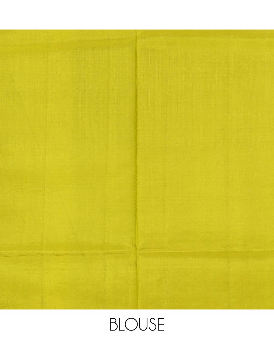 Parrot green zari buttas raw mango silk saree, Mughal border of elephant motifs, and pallu decked up with coconut tree, elephant, and butterflies