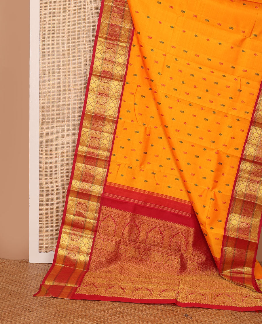 Yellow buttas Kanchipuram silk saree, contrast border of rudraksham, thazampoo rekku, arumbu manga, kathir, diamond, and mayil designs, and jaal pallu