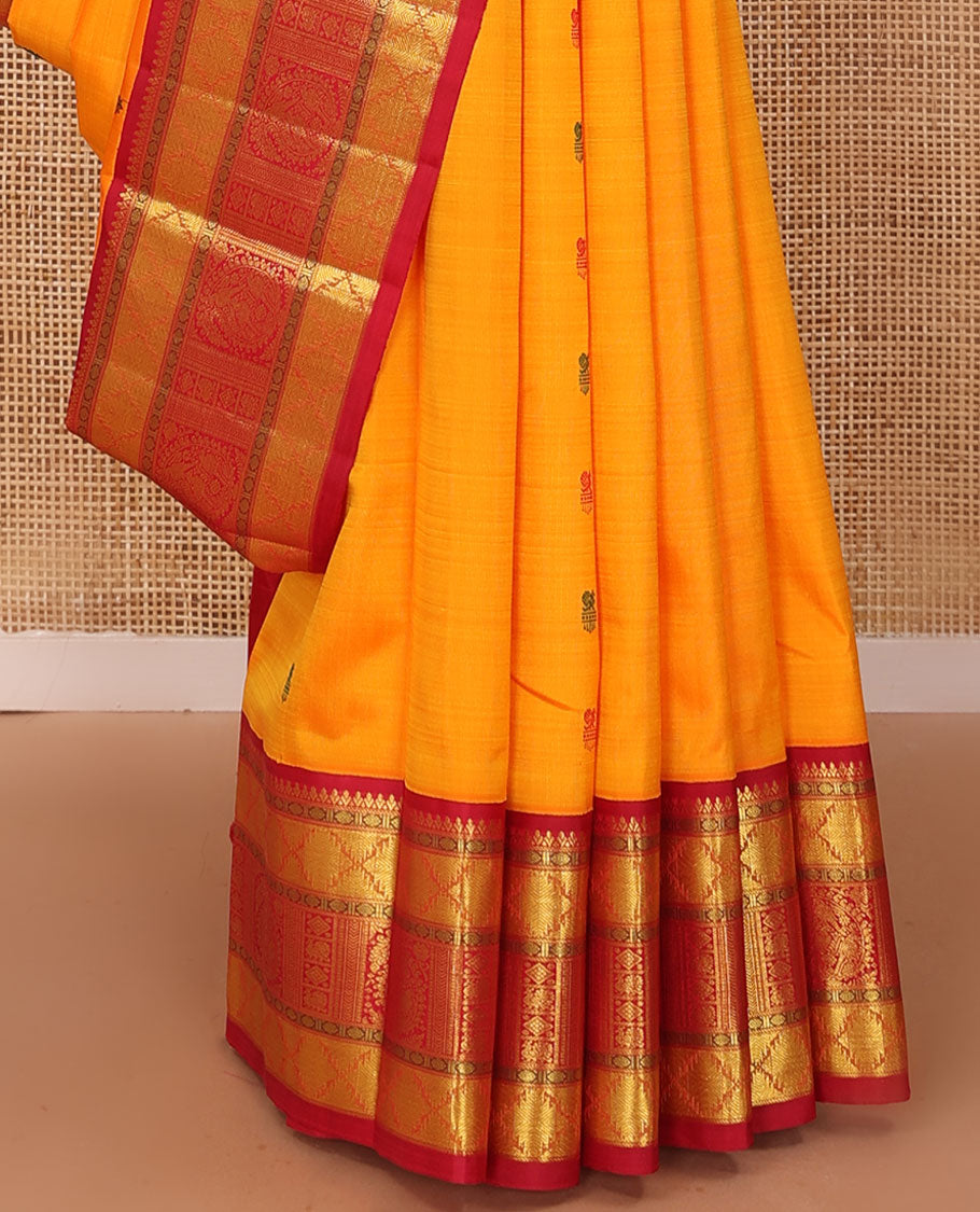 Yellow buttas Kanchipuram silk saree, contrast border of rudraksham, thazampoo rekku, arumbu manga, kathir, diamond, and mayil designs, and jaal pallu