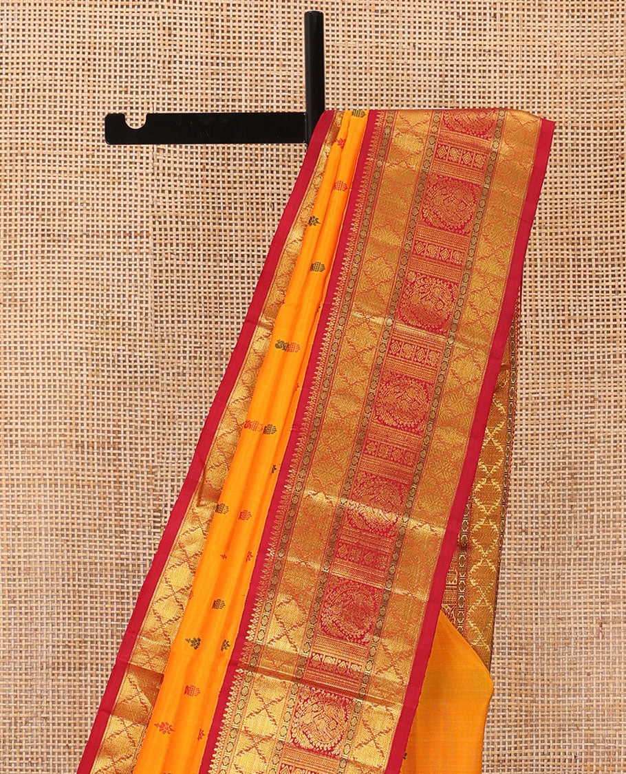 Yellow buttas Kanchipuram silk saree, contrast border of rudraksham, thazampoo rekku, arumbu manga, kathir, diamond, and mayil designs, and jaal pallu