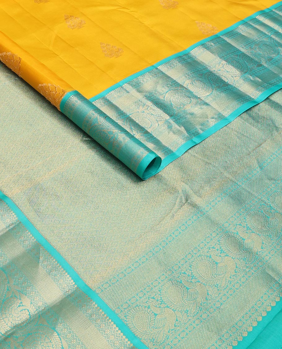 Yellow zari buttas silk saree, contrast border of salangai,neli,lavangam,mayil kann & dhavana kodi & jaal pallu