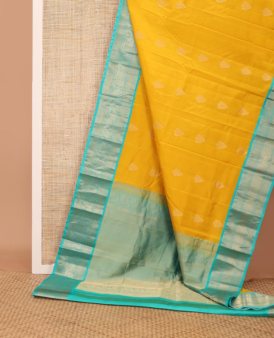 Yellow zari buttas silk saree, contrast border of salangai,neli,lavangam,mayil kann & dhavana kodi & jaal pallu