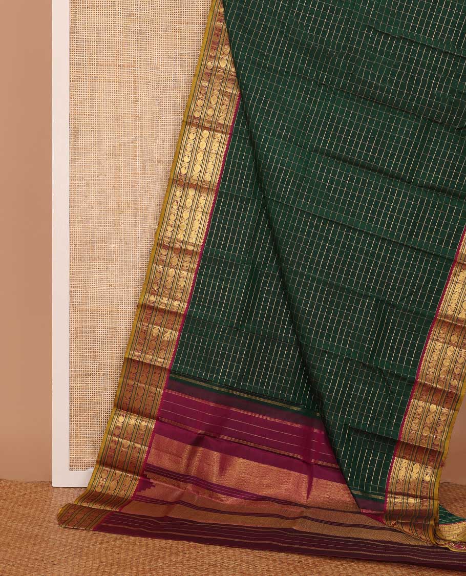Green zari checked Kanchipuram silk saree, contrast border of thilakam mokku,kathir, and mayil chakram designs, and thazampoo rekku pallu