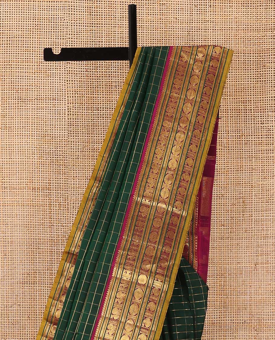 Green zari checked Kanchipuram silk saree, contrast border of thilakam mokku,kathir, and mayil chakram designs, and thazampoo rekku pallu