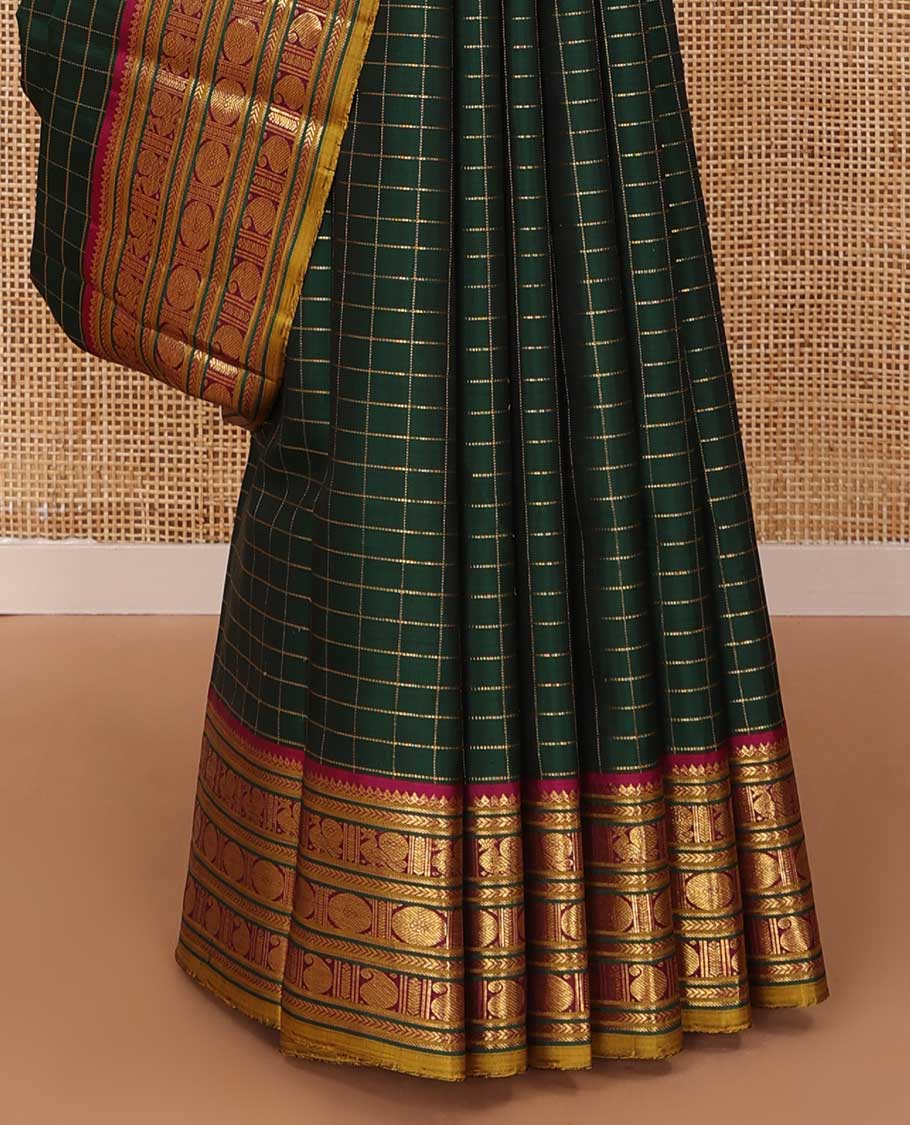 Green zari checked Kanchipuram silk saree, contrast border of thilakam mokku,kathir, and mayil chakram designs, and thazampoo rekku pallu