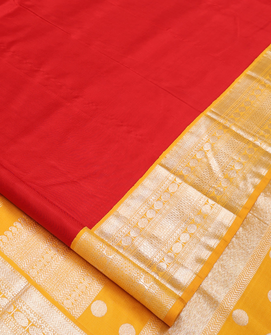 Red plain Kanchipuram silk saree, contrast korvai border of muthu, vanki, neli, rudraksham, and mayil kann, and traditional zari steeped pallu