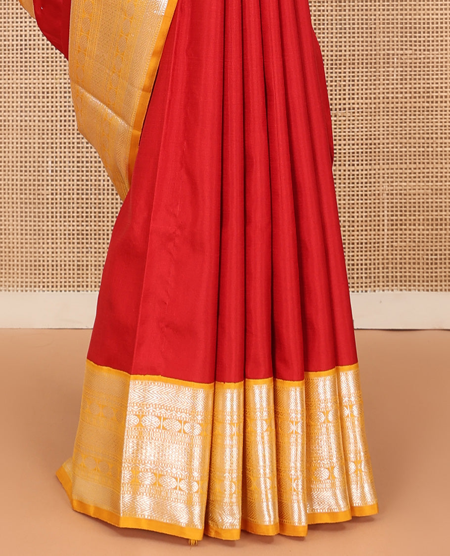 Red plain Kanchipuram silk saree, contrast korvai border of muthu, vanki, neli, rudraksham, and mayil kann, and traditional zari steeped pallu