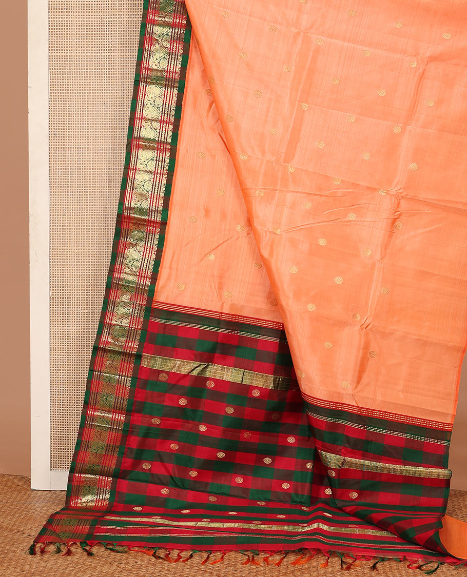 Peach zari buttas Kanchipuram silk saree, contrast one-sided korvai border of neli, and jadai nagam designs, and zari design pallu