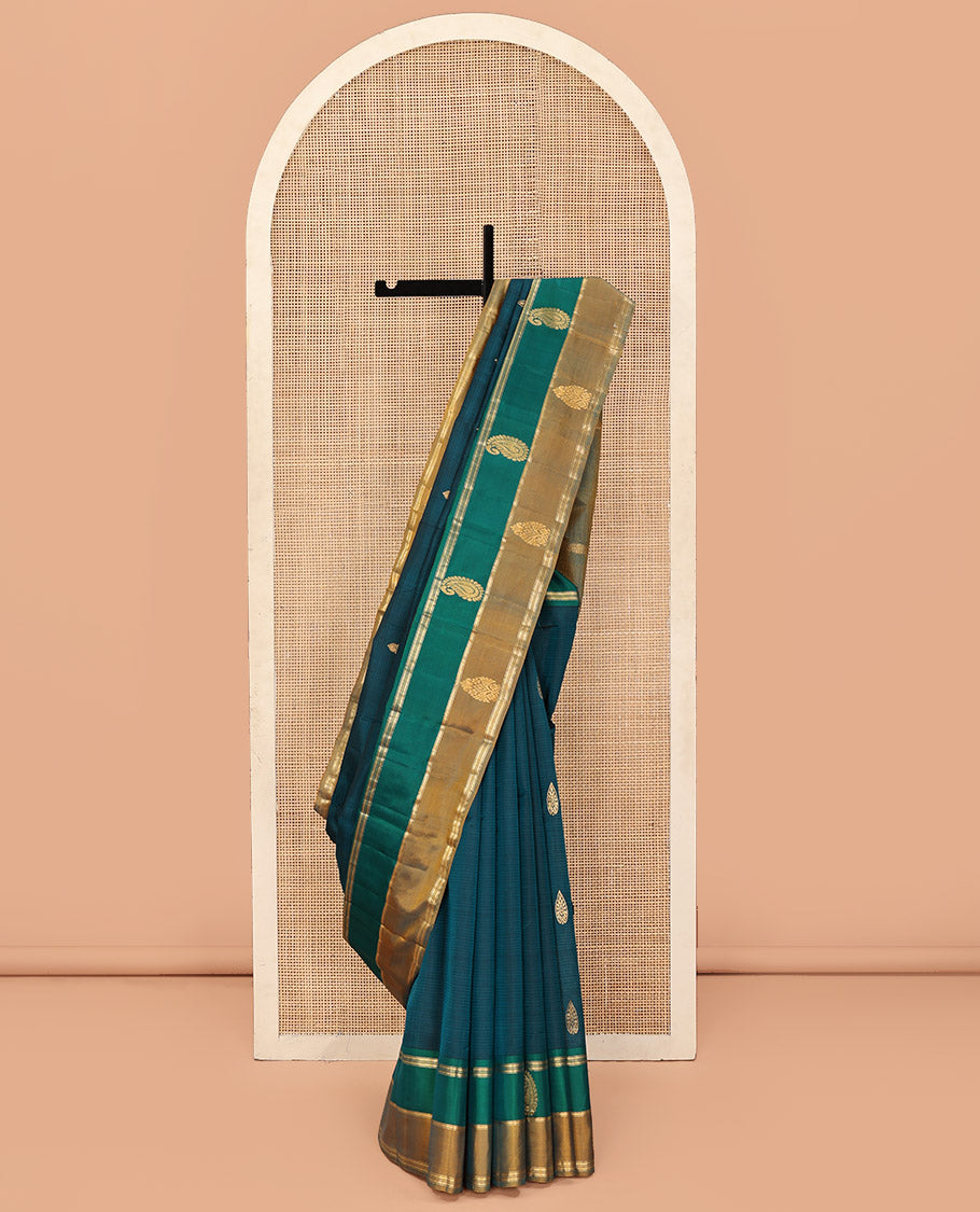 Peacock Blue Kanchipuram Silk Saree, Elevated with Zari Buttas and Vazhaipoo Stripes on Its Body, Complemented by a Contrast Border of Muthu, Kathir, and Arumbu Manga Designs, Pallu of Zari Designs, and Paired with a Contrast Blouse