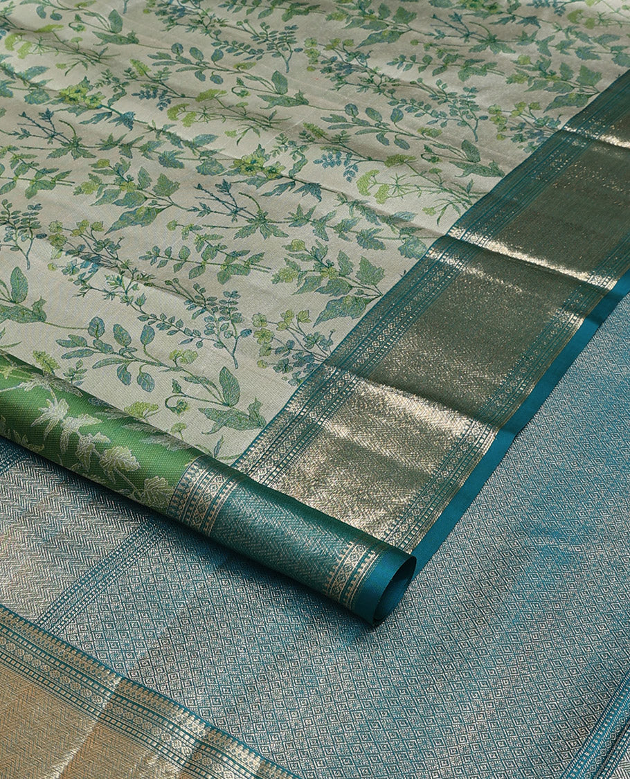 Green leaf printed silk saree, contrast border of thilakam mokku, muthu, diamond, and vanki designs, and jaal pallu