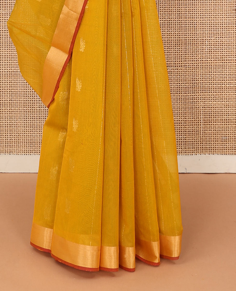 Mustard zari striped silk cotton saree, contrast bavanji border, and contrast pallu of floral creeper designs