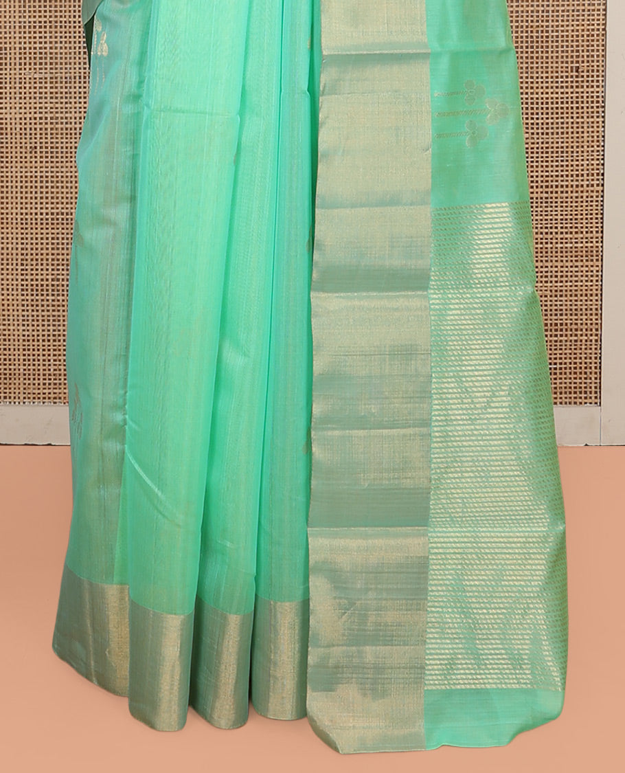 Green Silk Cotton Saree, Graced with Zari Buttas, a Zari Border, Gleaming Zari Pallu, and a Matching Blouse