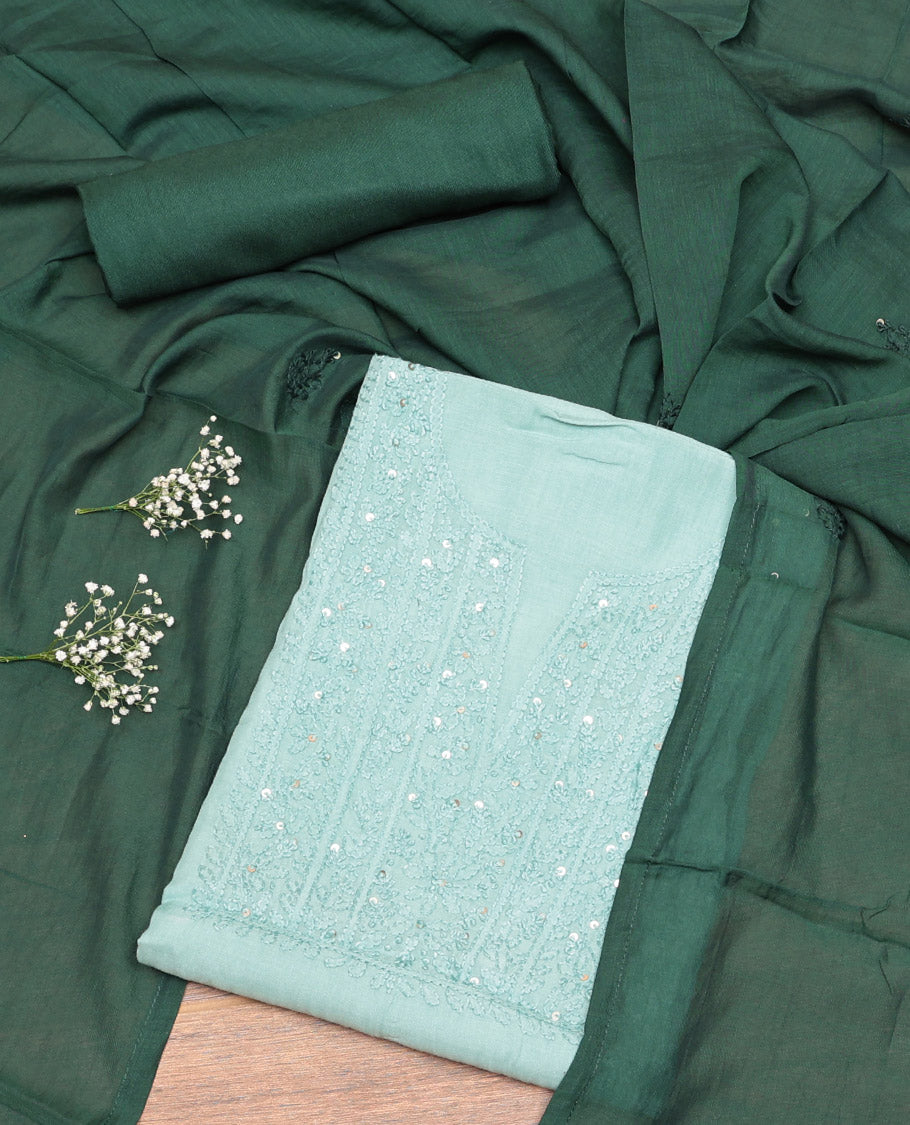 Pale Green Cotton Material Churidar Set, Delicately Designed with Sequined Thread Neck Work Top, a Contrast Plain Bottom, and Thread Dupatta