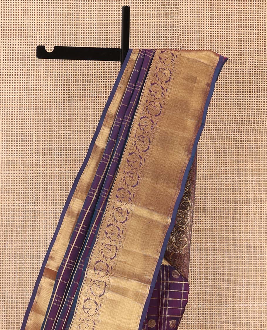 Purple annam chakram enclosed zari checked Vasundhara silk mix saree, zari border of rekku and kodi mayil designs, and jaal pallu