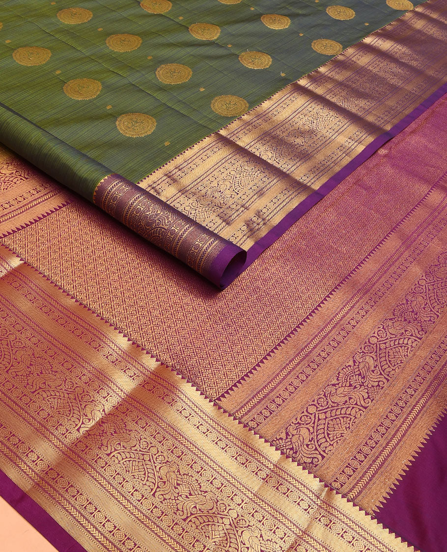 Green Vasundhara Lite Silk Mix Saree Highlighted with Chakram Buttas, Accentuated by a Contrast Border Featuring Rekku, Muthu, Kathir, Chakram, Star, and Mayil Designs, Pallu of Jaal design, and a Contrast Blouse