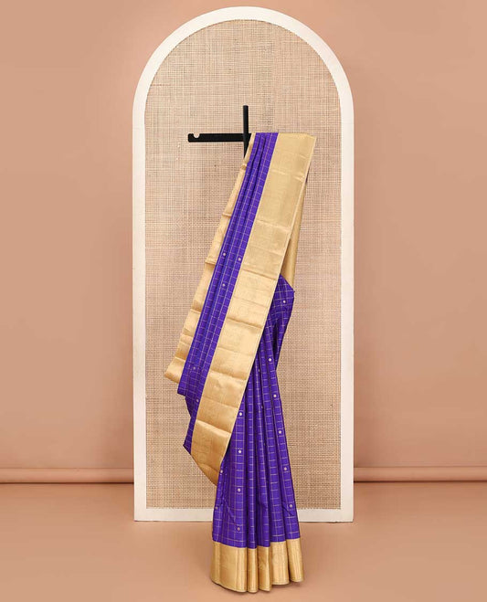 Blue zari kamalam buttas enclosed checked silk saree, contrast border of thilakam mokku, banaras, kathir, and mayil chakram, and jaal pallu