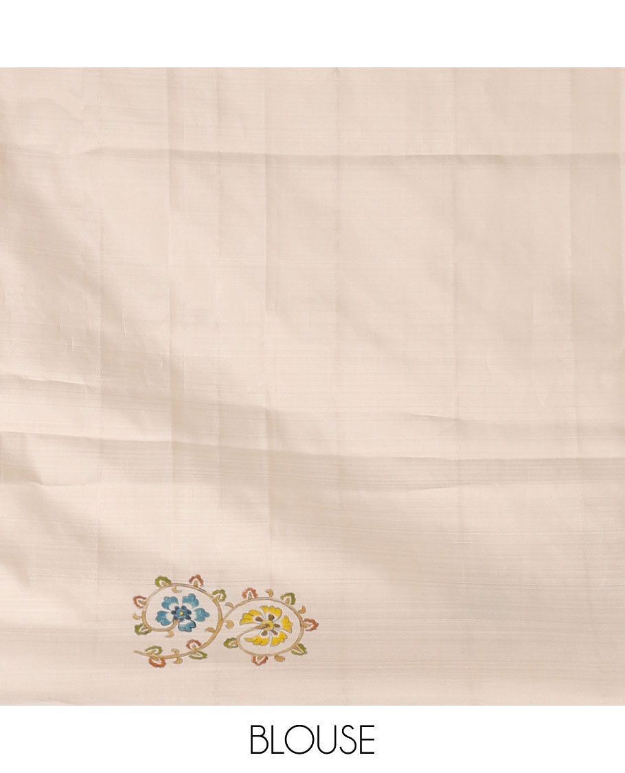 Enthralling cream kalamkari hand-painted silk saree featuring zari buttas with kalamkari floral vine, peacock, deer, & elephant motifs