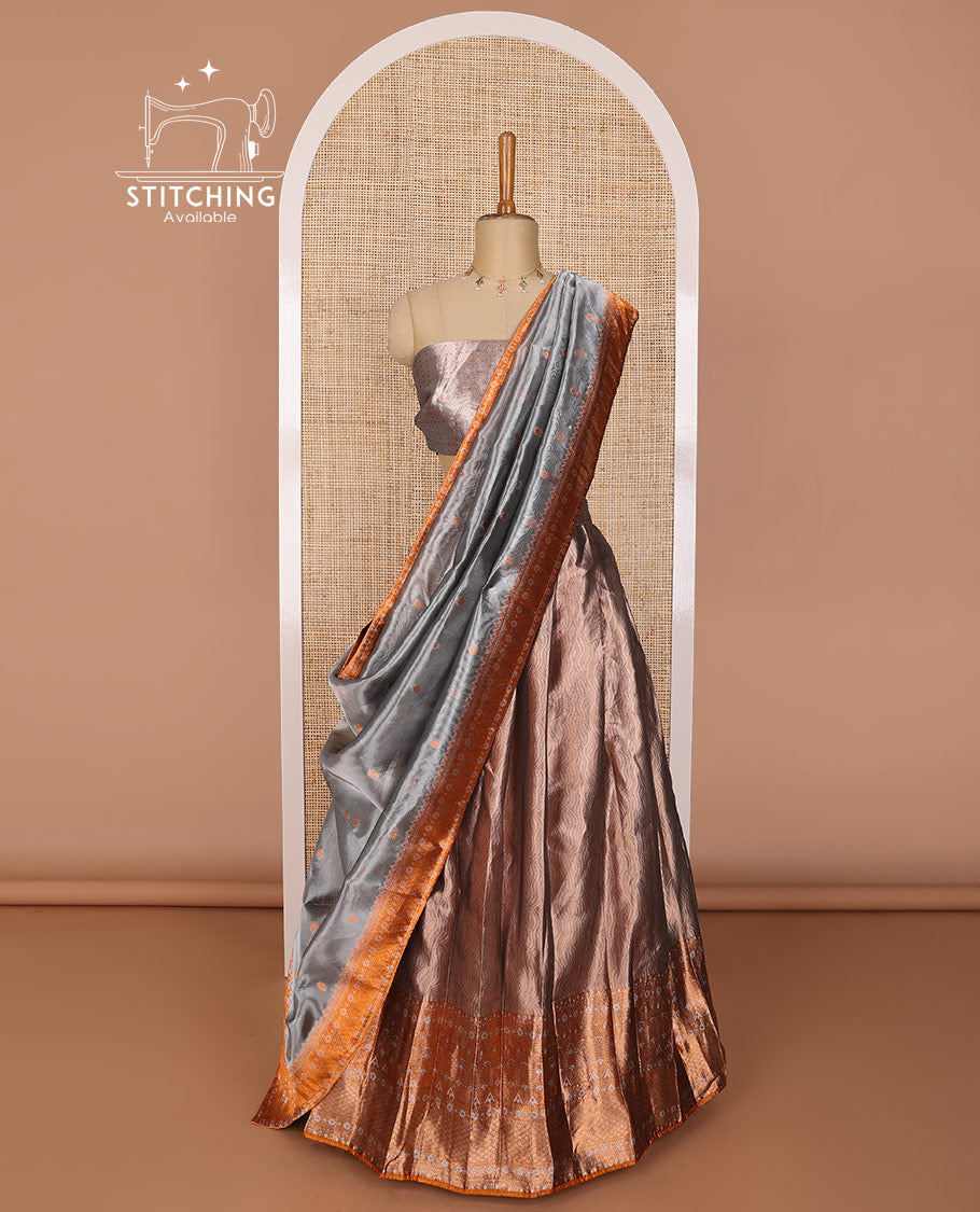 Brown tissue half saree with contrast intricate zari design border, zari design blouse & floral design dhavani