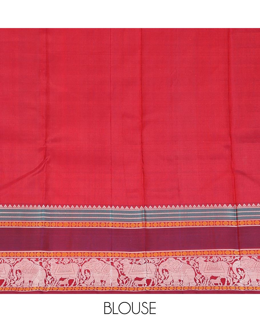 Orange thread buttas Kanchipuram silk saree, contrast rettai pettu border of rekku, rudraksham, yaanai, and Pichwai cow designs, and pallu features Vrishabha Kunjara design