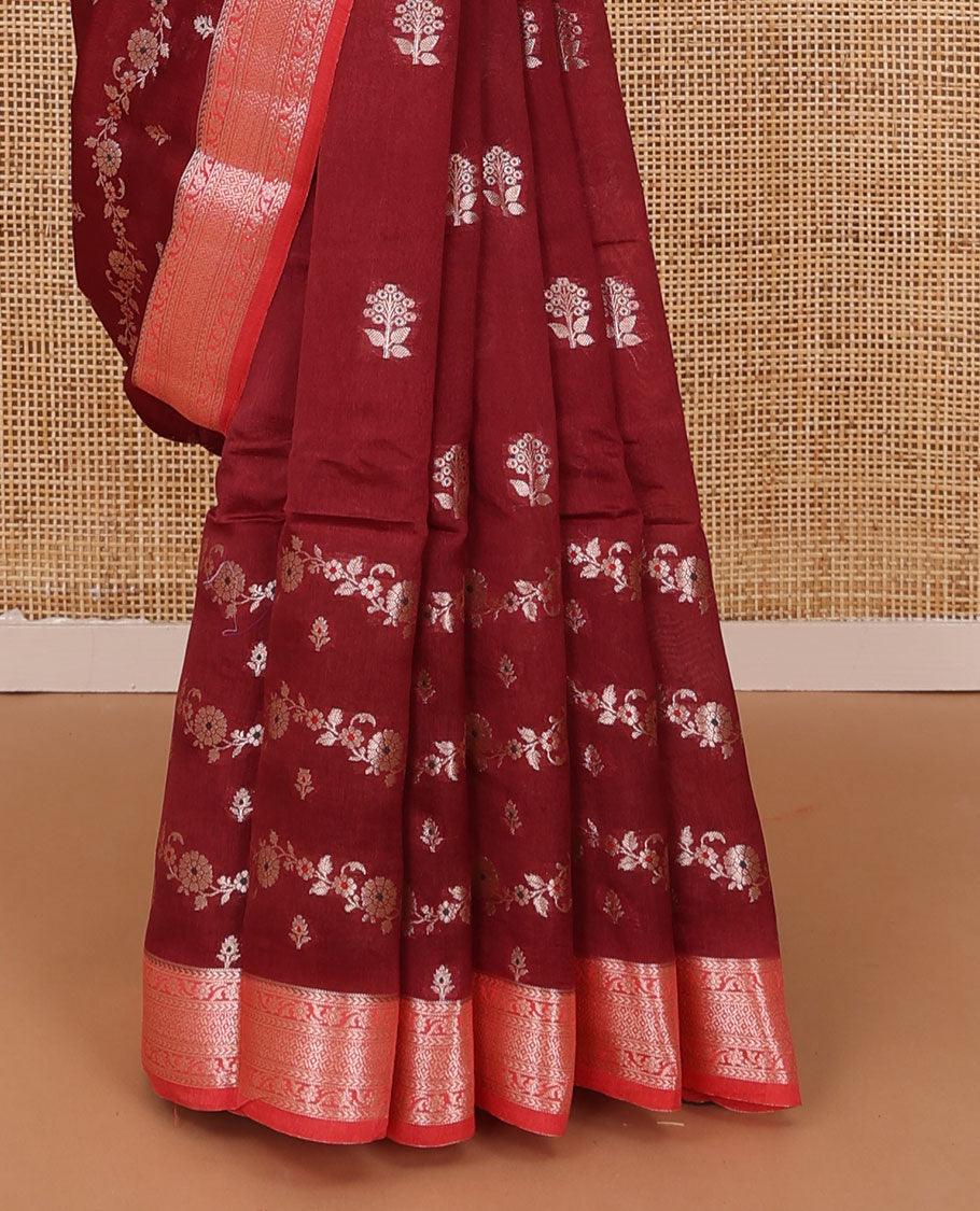 Maroon floral buttas, and floral creeper designs raw mango silk saree, contrast traditional zari border, and jaal pallu