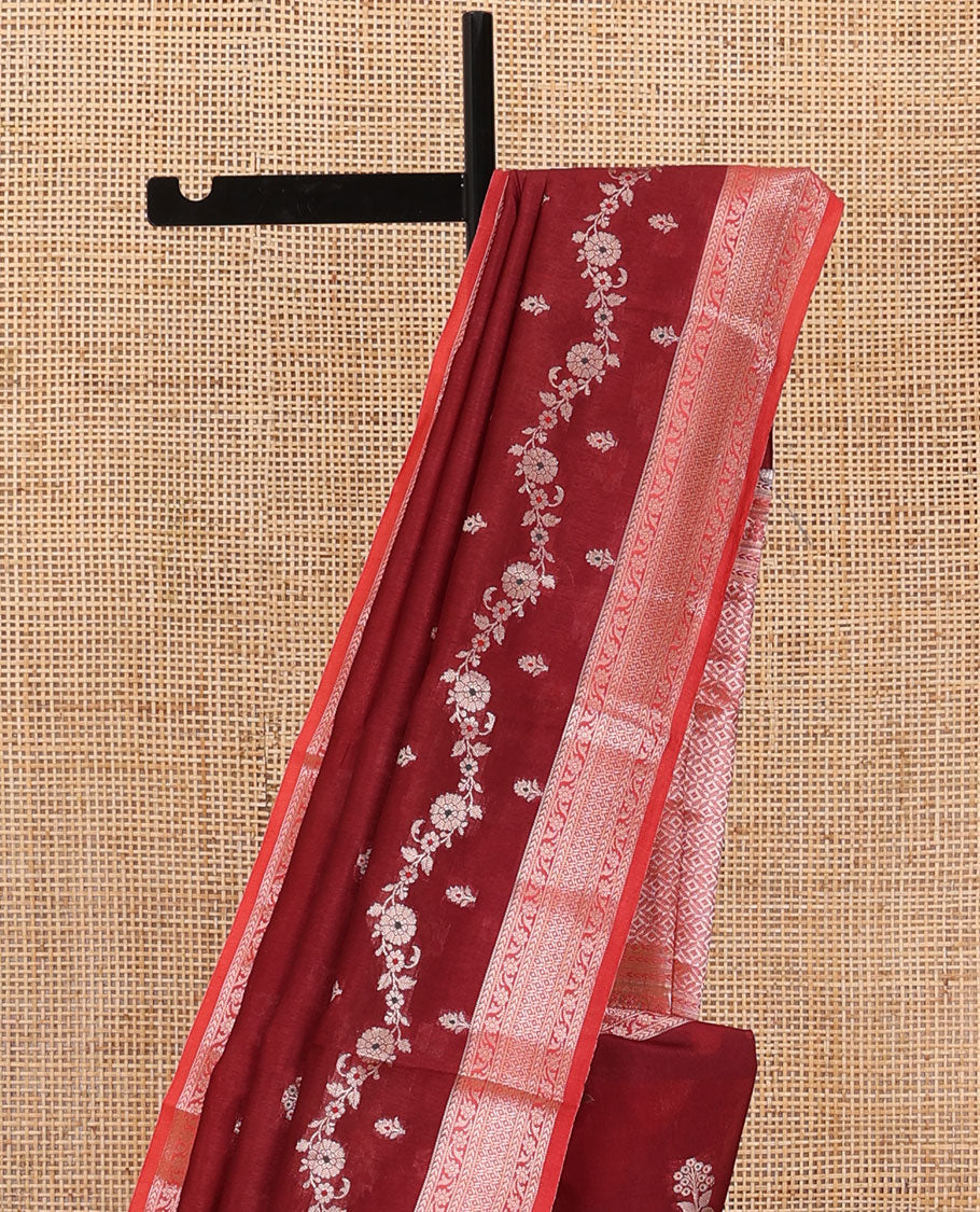 Maroon floral buttas, and floral creeper designs raw mango silk saree, contrast traditional zari border, and jaal pallu