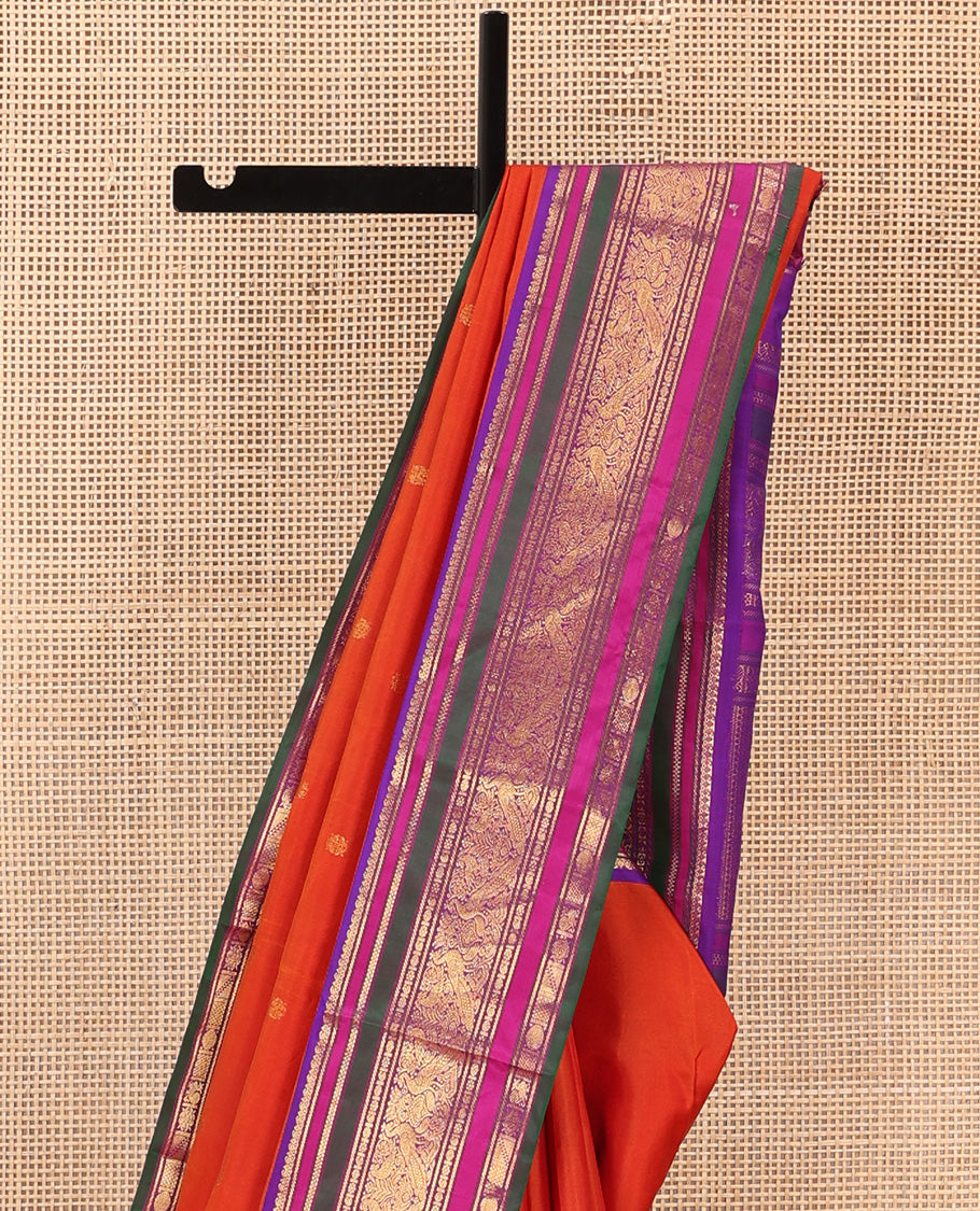 Orange zari buttas Kanchipuram silk saree, contrast border of manga mokku, banaras, kamalam, manga, rekku, mayil, and poun designs geometric patterned pallu