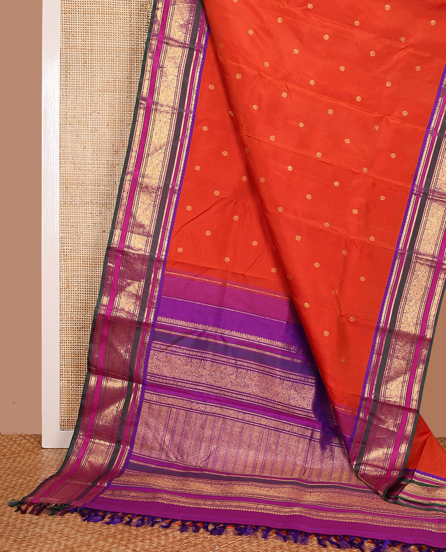 Orange zari buttas Kanchipuram silk saree, contrast border of manga mokku, banaras, kamalam, manga, rekku, mayil, and poun designs geometric patterned pallu