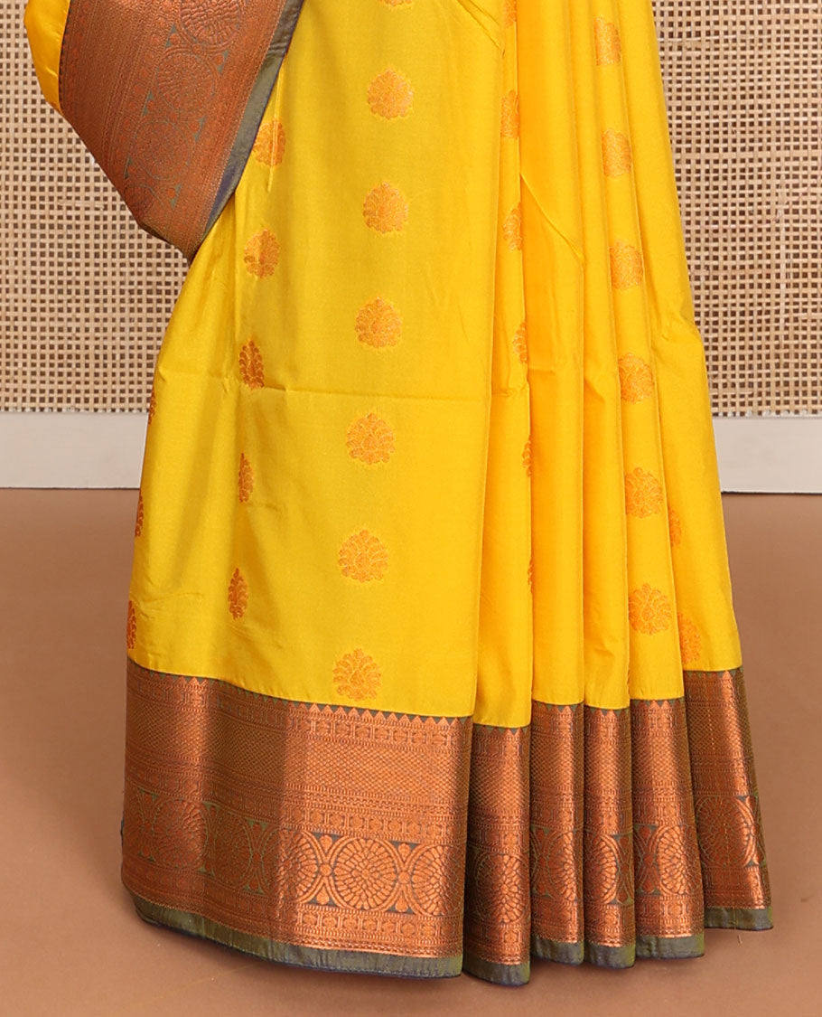 Yellow semi-soft silk saree with zari buttas, contrast traditional motifs zari border & pallu of jaal design