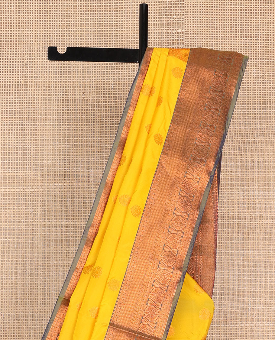 Yellow semi-soft silk saree with zari buttas, contrast traditional motifs zari border & pallu of jaal design