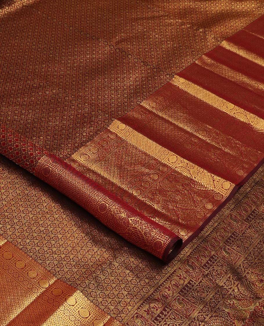 Maroon jacquard wedding silk saree, zari border of rekku, muthu, rudraksham, kamalam, then kuli kann, and mayil, and intricate pallu