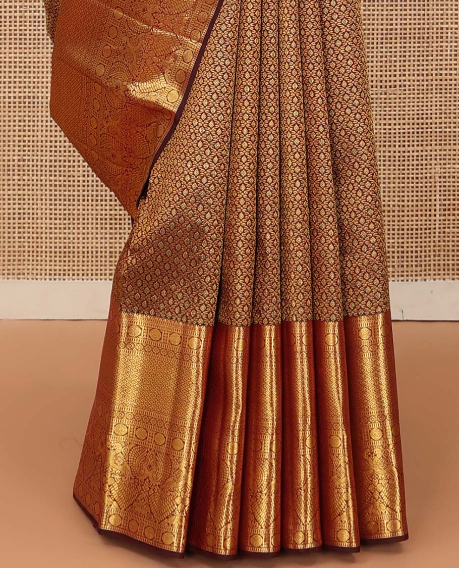 Maroon jacquard wedding silk saree, zari border of rekku, muthu, rudraksham, kamalam, then kuli kann, and mayil, and intricate pallu