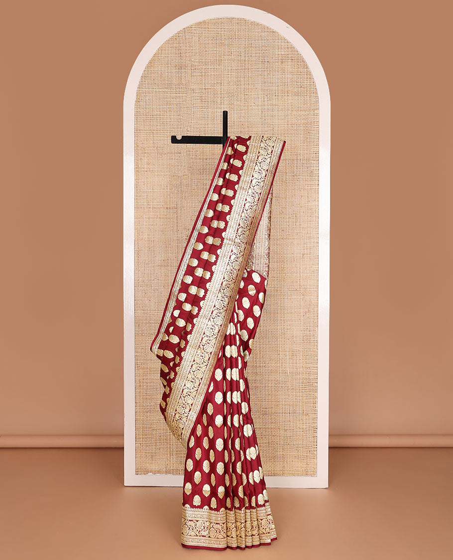 Maroon banarasi silk saree with zari buttas, self-border of floral creeper designs & pallu steeped with floral designs