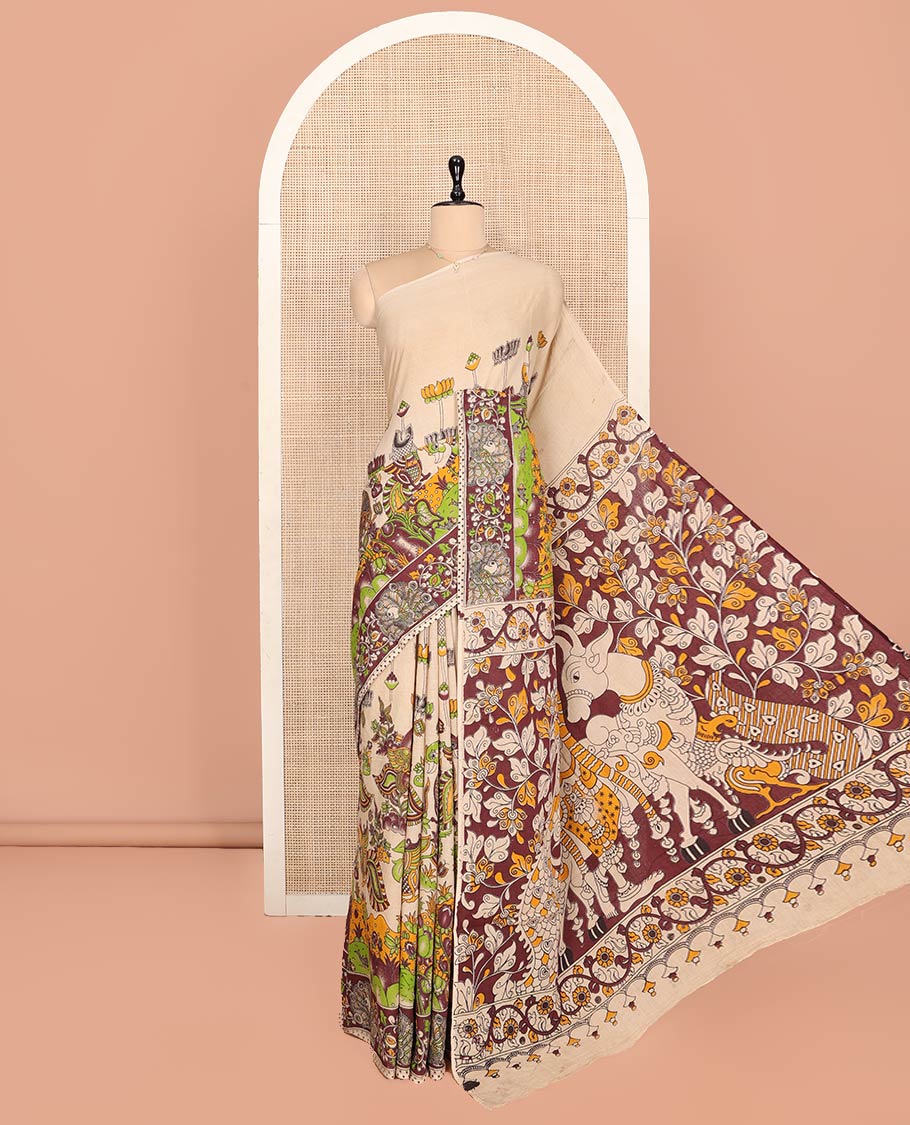 Sandal Machine-Printed Kalamkari Cotton Saree Features Flora-Fauna Motifs, a Contrast Peacock Border, Kalamkari Printed Pallu, and a Matching Blouse