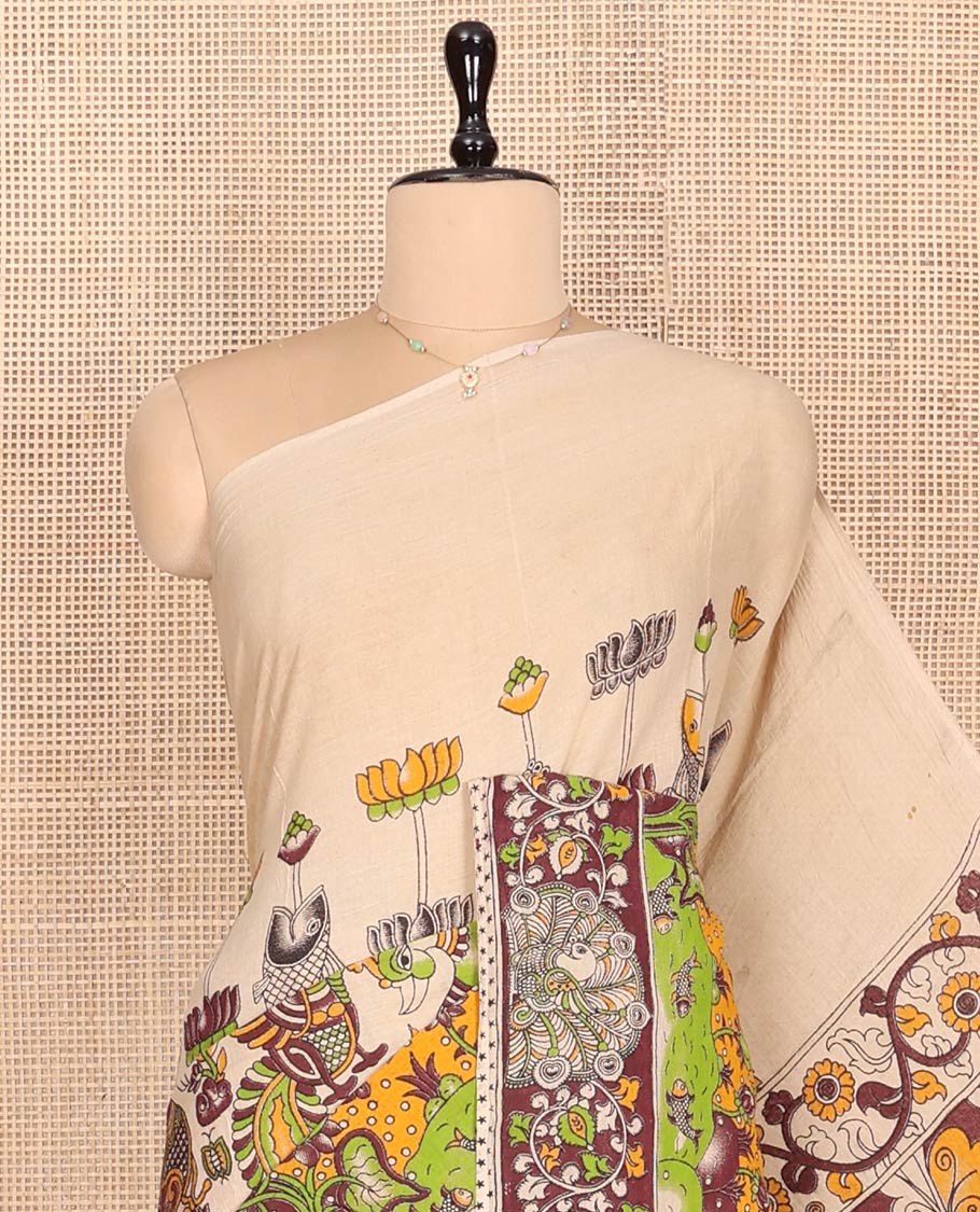 Sandal Machine-Printed Kalamkari Cotton Saree Features Flora-Fauna Motifs, a Contrast Peacock Border, Kalamkari Printed Pallu, and a Matching Blouse