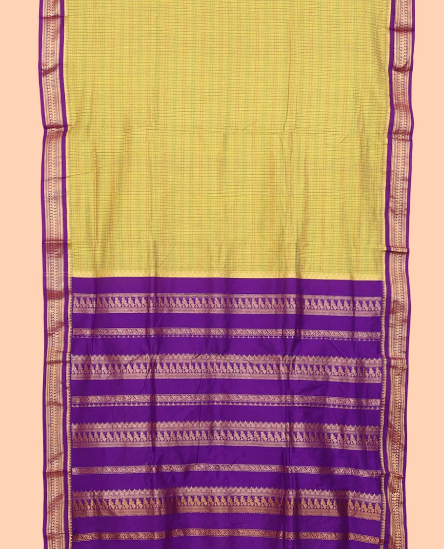Green checked nine-yard cotton saree, contrast temple traditional zari border of peacocks, and traditional design pallu