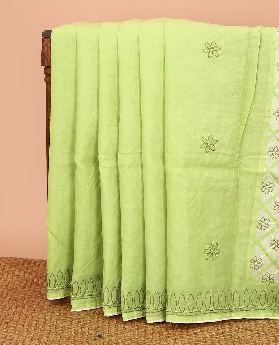 Green flowers thread embroidered Lucknowi chikankari saree, ogee patterned border, and floral embroidered pallu